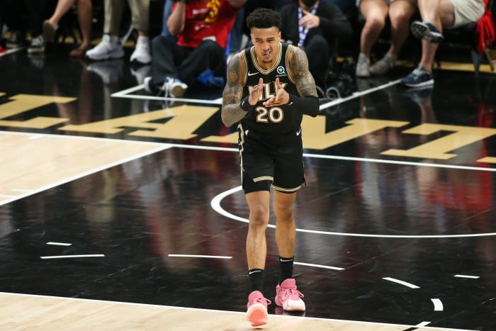 Atlanta Hawks forward John Collins (20) celebrates after a dunk against the Philadelphia 76ers in the third quarter during game four in the second round of the 2021 NBA Playoffs at State Farm Arena.
